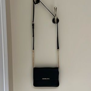 Michael Kors Black Pebbled leather crossbody bag.